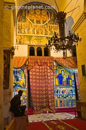 caption: Paintings in the old church of 'St Mary of Zion' and the covered entrance to the inner chapel.