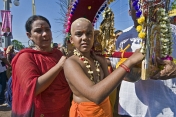 Young boy carries Kavadi burden to take part in the Thaipusam pilgrimage