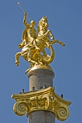 The golden statue of St George killing the Dragon tops the column in Freedom Square.