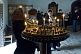 Image of A worshippers gather by candle-light during mass at the Ananuri Monastery.