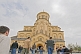 Image of Eastern Orthodox worshippers walk to mass at the Sameba Cathedral.