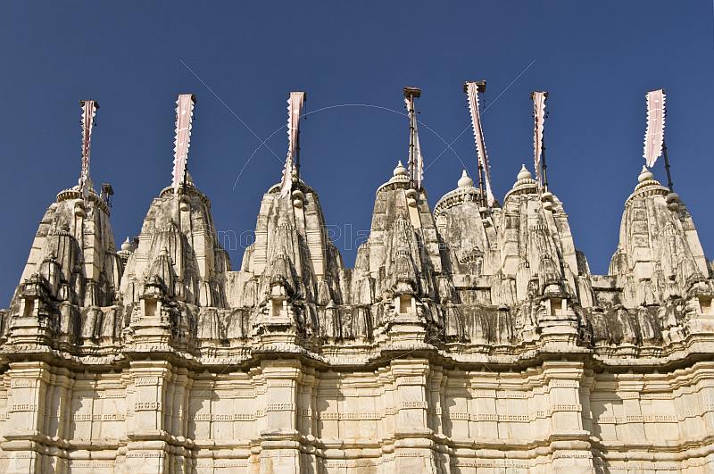 Jain towers with banners on the roof of the Adinatha Temple at Ranakpur.