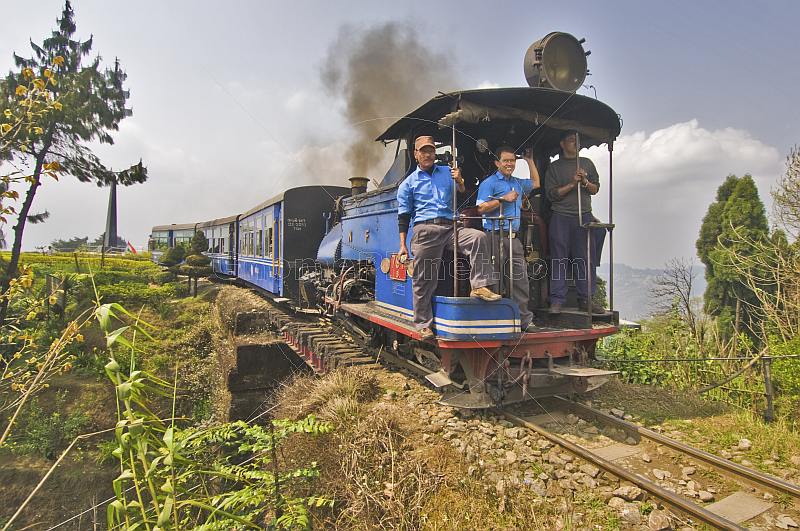 A steam train on the Himalayan Mountain Railway crosses over its own lines at the Batasia Loop.