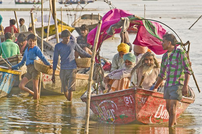 Boat of Sikh pilgrims return from visiting the Ganges Yamuna river Sangam.