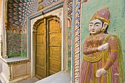 Detail of one of the plasterwork figures adjacent to the Peacock door in the City Palace complex.