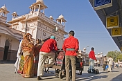 Porters and passengers wait for an early morning train at Bikaner station.