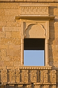 Richly-carved wall and window surround on a havelli in the old quarter.
