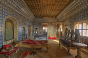 Maharajas bed chamber and huge night-gown in the seven-storey Juna Mahal.