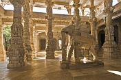 Intricately carved white marble elephant and interior of the Adinatha Temple at Ranakpur.