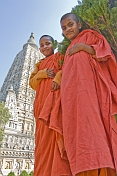 Two novice Buddhist monks in front of the Mahabodhi Temple, where the Buddha achieved enlightenment.