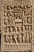 Detail of carving on the West Gateway of the Main Stupa, which portrays the seven incarnations of the Buddha.