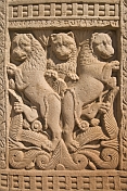 Detail of carving on the West Gateway of the Main Stupa, portraying three lions.