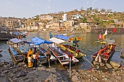 Ferry boats ply the Narmada River crossing to the Sri Omkareshwar Mahadeo Temple.