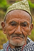 Sikkimese mountain man with traditional hat.
