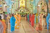 caption: Indian worshippers at the Sunday Christian mass in the Lady of Good Voyage church at Vizhinjam.