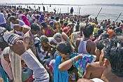 Mass crowds of Hindu pilgrims bathe at Ganges Sangam on Basant Panchami Snana.