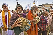 Hindu musicians with tabla and cymbals in Basant Panchami Snana Procession.