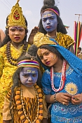 Four Children In Colorful Clothes And Face Paint Decorated As Hindu Gods