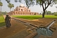 Image of Indian woman wearing a sari in the gardens of Humayun's Tomb.