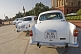 Image of White Ambassador government cars waiting outside the Lutyens-designed North Block Secretariat.