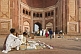 Image of Religious trinket-sellers wait for pilgrims at the entrance to the Jami Masjid built 1571.