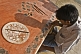 Young craftsman works on a Pietra-Dura inlaid-marble panel.