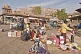 Image of Traders sell material and clothing in Sardar Market.