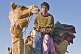 Image of A young camel-driver enjoys an early morning cup of tea.
