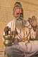 Image of A friendly mendicant Babu, a follower of Shiva, poses for his photograph.