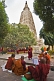Image of Buddhist monks wait for services to begin next to the Mahabodhi Temple.