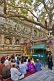 Japanese pilgrims receive guidance and instruction under the Tree of Enlightenment at the Mahabodhi Temple.