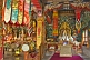 Image of Buddhist statue in colorful robes at the Bhutanese Temple.