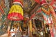 Image of Buddhist statue in colorful robes at the Bhutanese Temple.