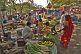 Image of A man sells vegetables to pilgrims coming down from Vaibhara pilgrimage hill.