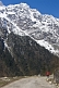 Image of Tourist views the snow-covered mountains on the road to Kalep.
