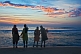 Image of Four young Indian women watch the sunset.