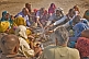 Family Group Perform Hindu Fire Ceremony By Ganges River