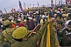 Image of Indian police control the dense crowds at Basant Panchami Snana procession.