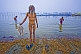Image of Elderly Brahmin pilgrim takes ritual bathe at dawn in Ganges Yamuna river Sangam.