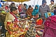Image of Hindu Holy Man provides religious requirements for Pilgrims at Kumbh Mela festival.