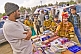 Three Face-Painted Children Look At Kumbh Mela Book Stall