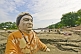Statue Of Unknown Swami In Saffron Tunic Buried In Ganges Mud And Silt