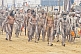 Naked Naga Holy Men walk in procession from Ganges river ritual bathing ceremony.