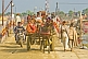 Horse and cart with Hindu Mela pilgrims cross Ganges River pontoon bridge.