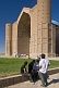 Image of A group of young student visitors look at the Yasaui Mausoleum.