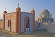 Brick-built Muslim graves and mausoleums in the early morning sunlight.