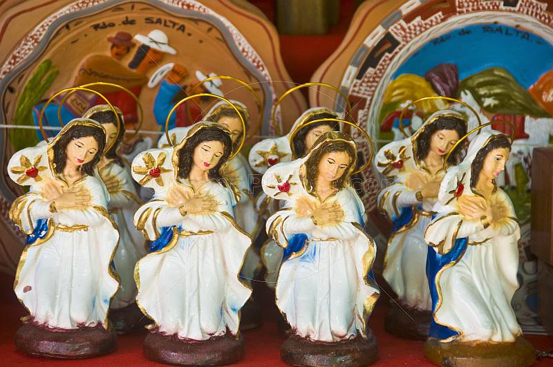 Ceramic statues of the Virgin Mary at a souvenir shop.