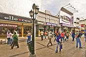 Pedestrian precinct busy with shoppers on the Calle Florida.