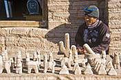 Models of llama and cacti made from rock salt at the Sal de Guayatayoc salt pans