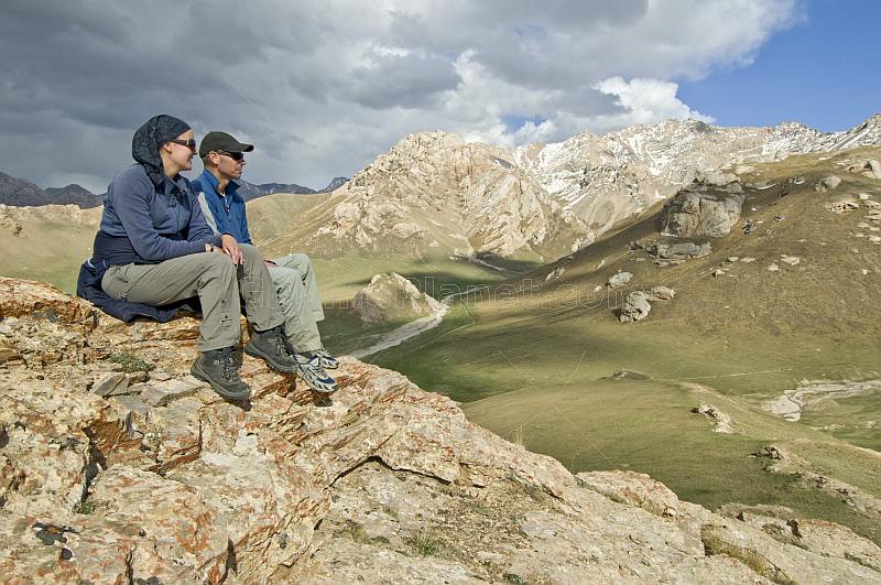 Tourists viewing mountain scenery of the At-Bashy Range, on the road to the Torugart Pass to China.